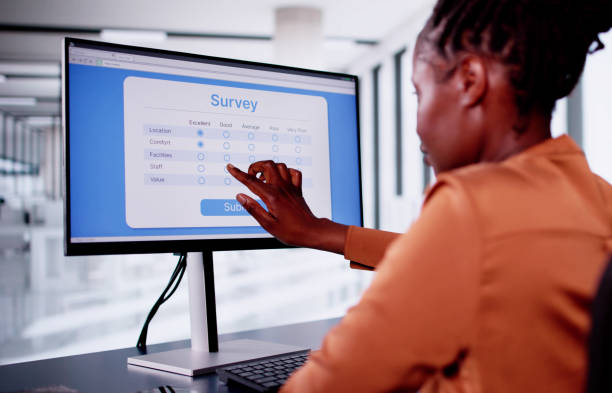 Researcher completing a digital survey for baseline, midline and endline studies